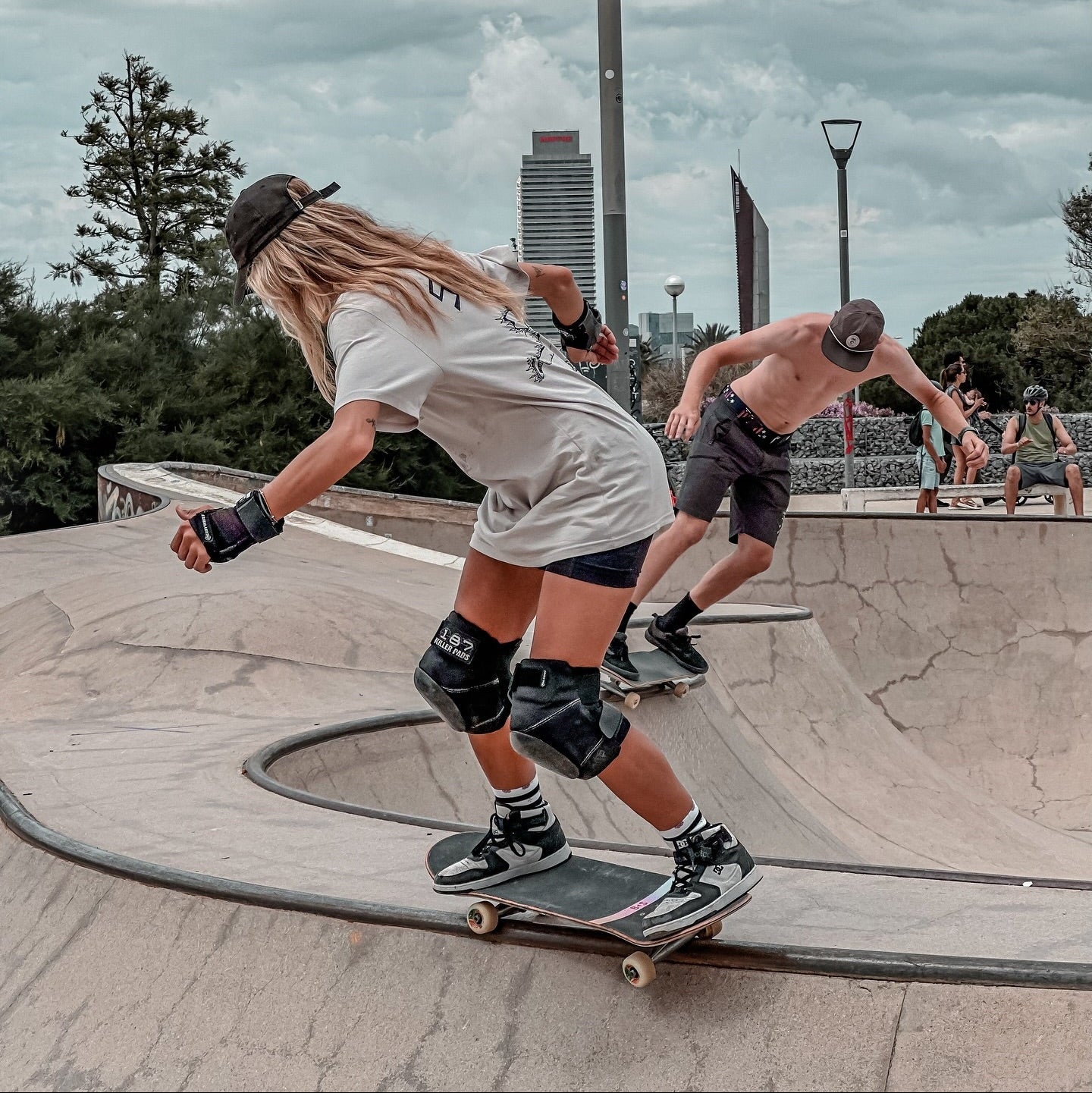 vale keisel skating bowl in barcelona wearing stoked guy clothing bone original tee and pads for protection