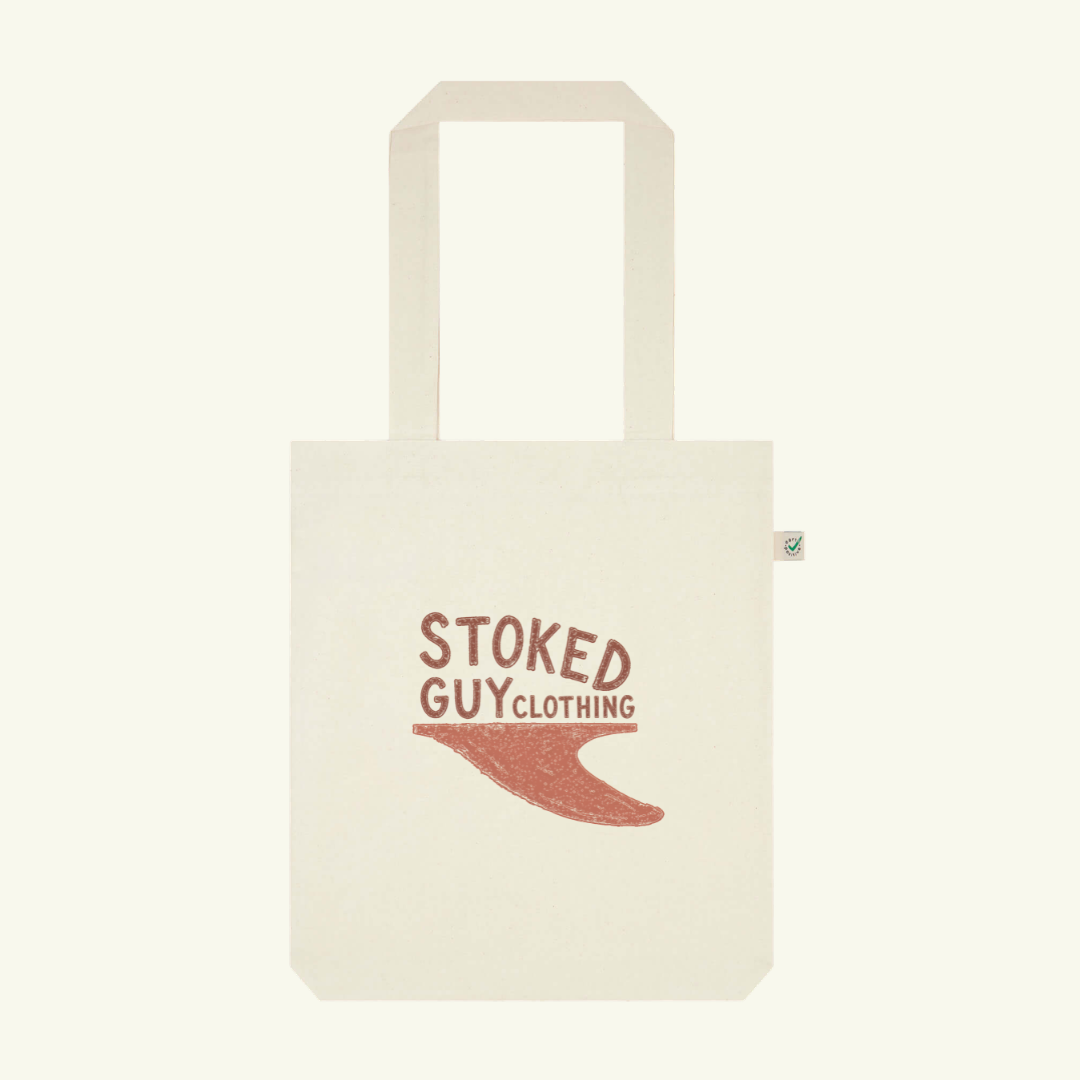 Beige tote bag with 'Stoked Guy Clothing' text and logo on a white background