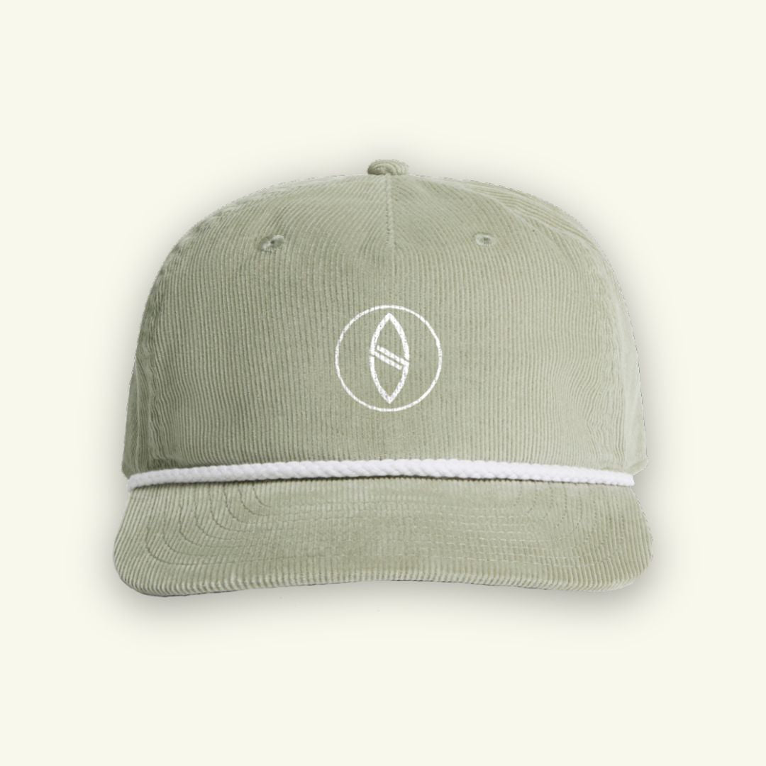 Green cap with a white logo on a light gray background