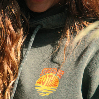 Person wearing a hoodie with 'Spaced Out Clothing' logo